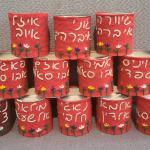 הילדים שנרצחו מרקטת חיזבאללה באסון במג'דל שמס כבר זכו לנרות נשמה רקומים עם שמם, שינציחו את זכרם